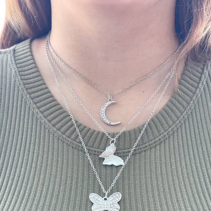 Harris Girls & Co. - Wholesale Pendant/Charm Necklace - "Butterfly In The Sky" Layered Necklace Silver