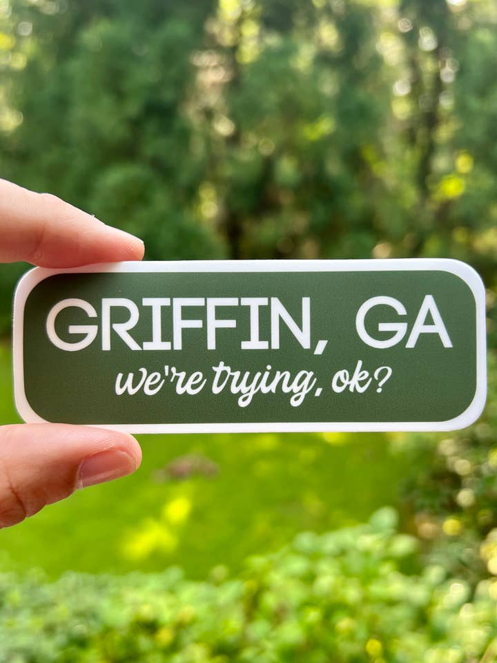 Griffin, GA- We're trying, ok? {sticker} for wholesale by Uncle Dunc's Sticker Shoppe