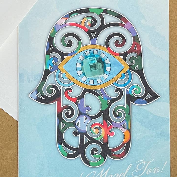 Mazel Tov Hamsa for wholesale by Russell Jeffery Design by Off By Heart Design