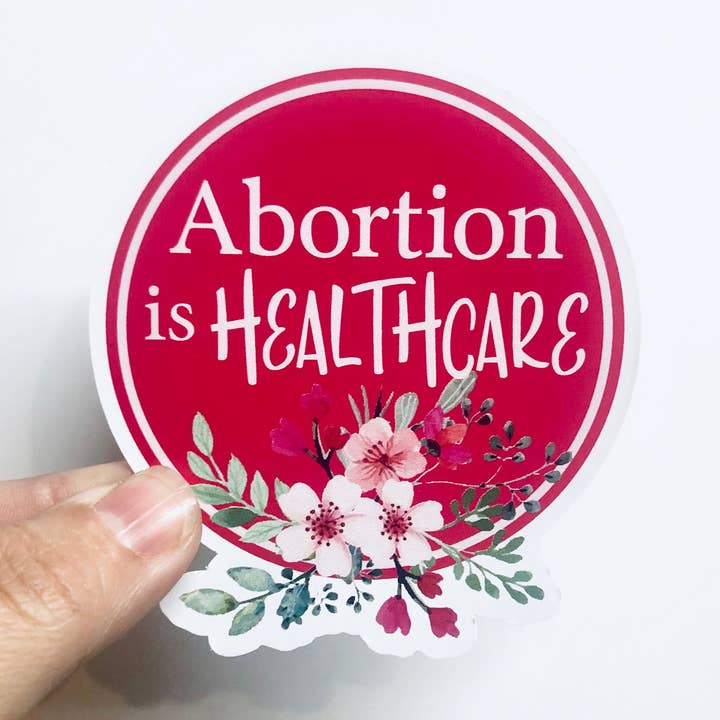 abortion is healthcare floral sticker for wholesale by Anthem Sticker Company
