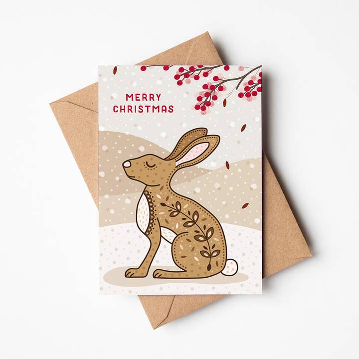 Snowy Illustrated Hare Christmas Card for wholesale by Jess A Little Creative