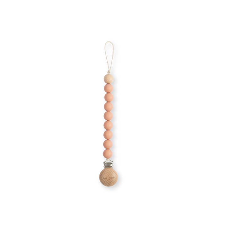 Pacifier Clip Holder | Silicone + Beech Wood | Muted Clay and other Purchase Wholesale pacifier clips. Free Returns & Net 60 Terms on Faire trending on Faire.