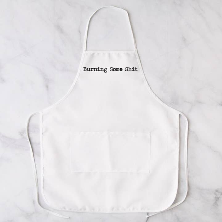 Burning Some Shit White Apron, Apron, Funny Apron, Custom Apron, Cleaning Apron Chef Apron, Novelty Apron, Linen, Cooking Apron for wholesale by Brandi Dai Designs