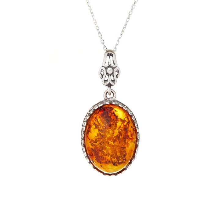 Oval cognac amber pendant, antique silver 925, 2+1 cm for wholesale on Faire