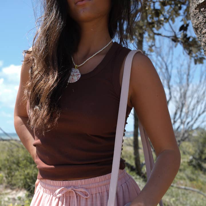 Karma Ribbed Tank Top and other Purchase Wholesale stringer tanks. Free Returns & Net 60 Terms on Faire trending on Faire.