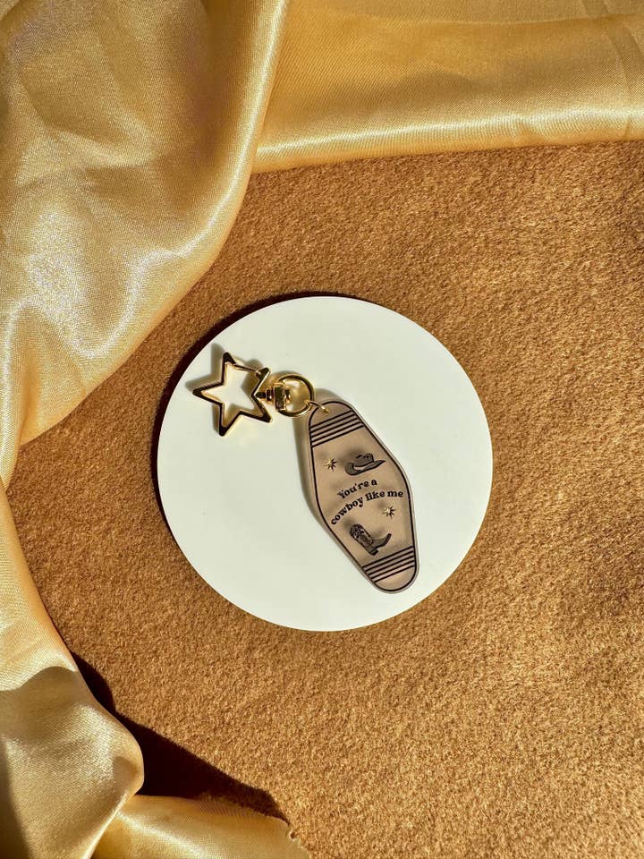 Cowboy Like Me nøglering | Taylor Swift | The Eras Tour for engroshandel hos Gees Jewellery