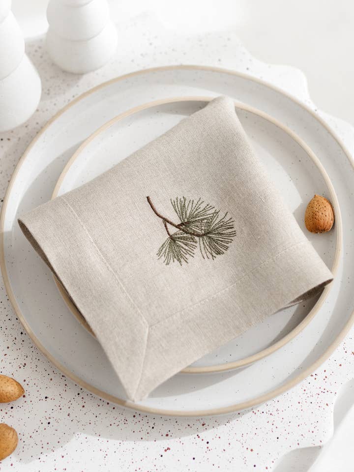 Linen napkin with pine tree embroidery and holder for wholesale by Matrinna