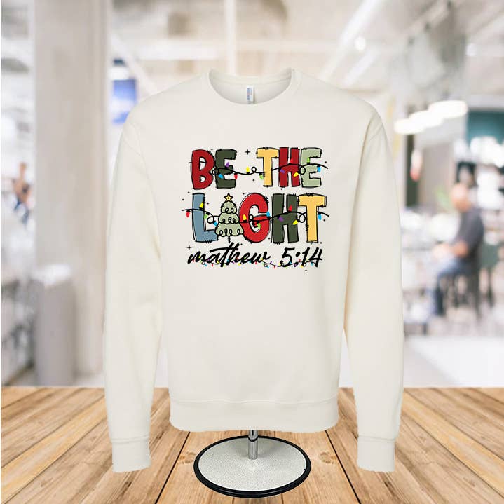Sudadera con cuello redondo Be the Light para venta al por mayor de Infidel Nation Apparel