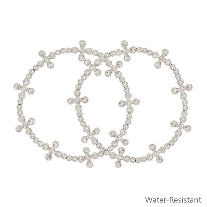 Wasserabweisendes, silberfarbenes, kreuzförmiges Stretch-Armbänder, 2 Stück für den Großhandel von What's Hot