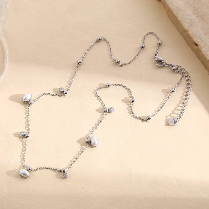 Sølvcollier med fin kæde og glatte gyldne perler for engroshandel hos JOYA