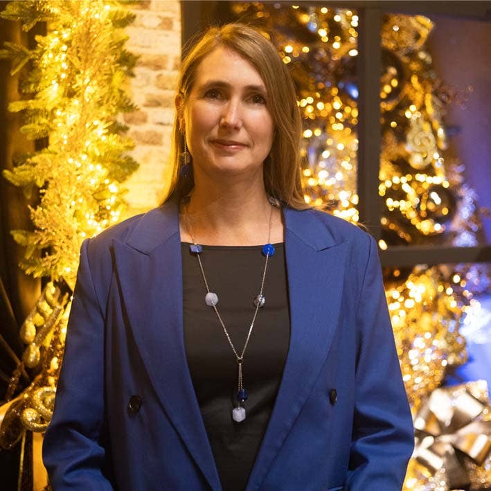 Long necklace with 9 mini cubes in shades of blue for wholesale by FATES, style with a story