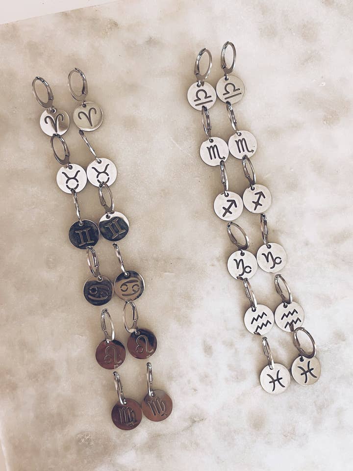 Zodiac Huggies (SET OF 12) for wholesale by The Butterfly Effect