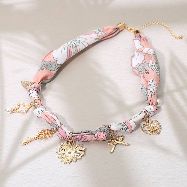 Sensibling Corp. - Wholesale Pendant/Charm Necklace - Metal Heart Bow Pearl Quatrefoil Key Charm Station Fabric Scarf Necklace