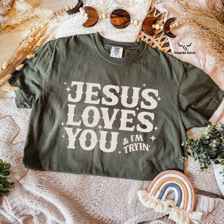 JESUS LOVES YOU & I’M TRYIN’ TEE for wholesale by Cowpoke Corral