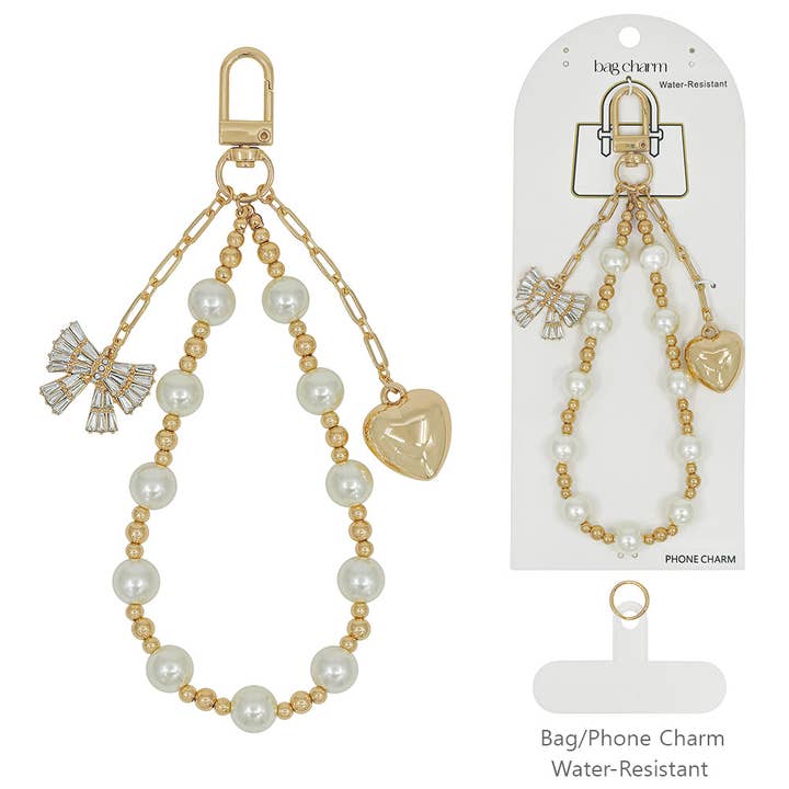 Pendentif de sac en perles et or avec cœur gonflé et nœud en cristal pour la vente par What's Hot