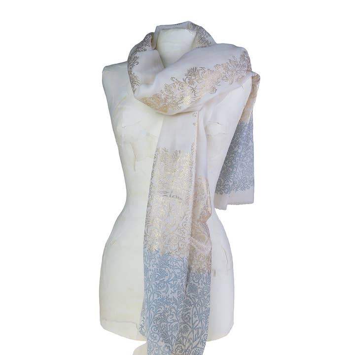 Wool and silk stole with a white background, golden arabesques. for wholesale by Epigram