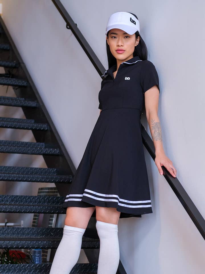 Abito polo con zip frontale - Bianco e nero per la vendita all'ingrosso da parte di Bov active