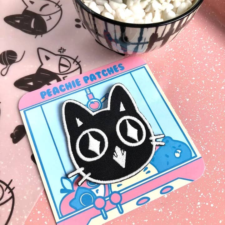 GLOW IN THE DARK EXCITED CAT EMBROIDERED IRON ON PATCH for wholesale by Peachie Patches