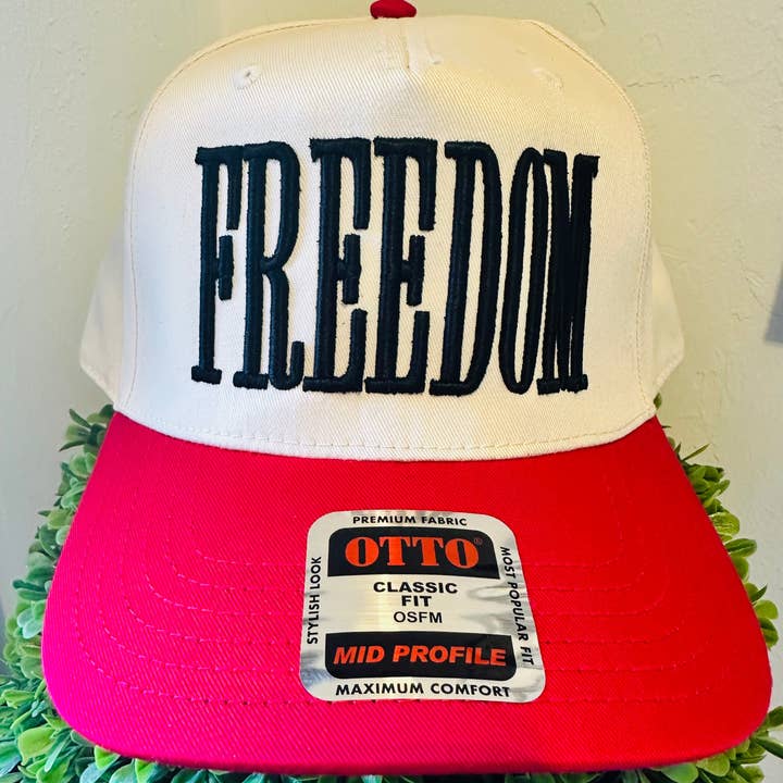 FREEDOM BLACK PUFF EMBROIDERY ON A NATURAL AND RED HAT for wholesale on Faire0