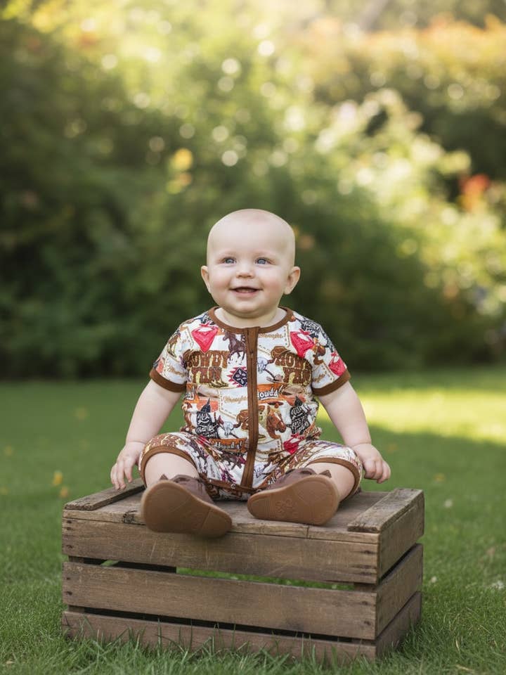 Howdy" Western printed baby romper with snaps.SR112711-SOL for wholesale by Kids Charm Online