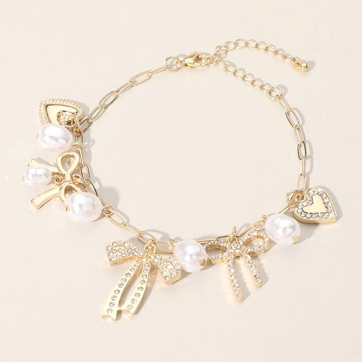 Sensibling Corp. - Wholesale Charm/Dangle Bracelet - Stone Paved Bow Heart Pearl Charm Station Chain Bracelet