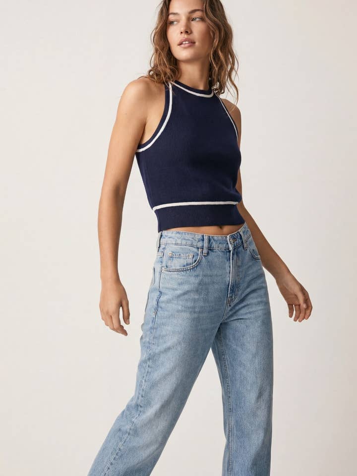 Sleeveless Knitted top In navy Featuring detail white Lines for wholesale by Q2—All Orders:Free Duties for the US,UK,and Canada