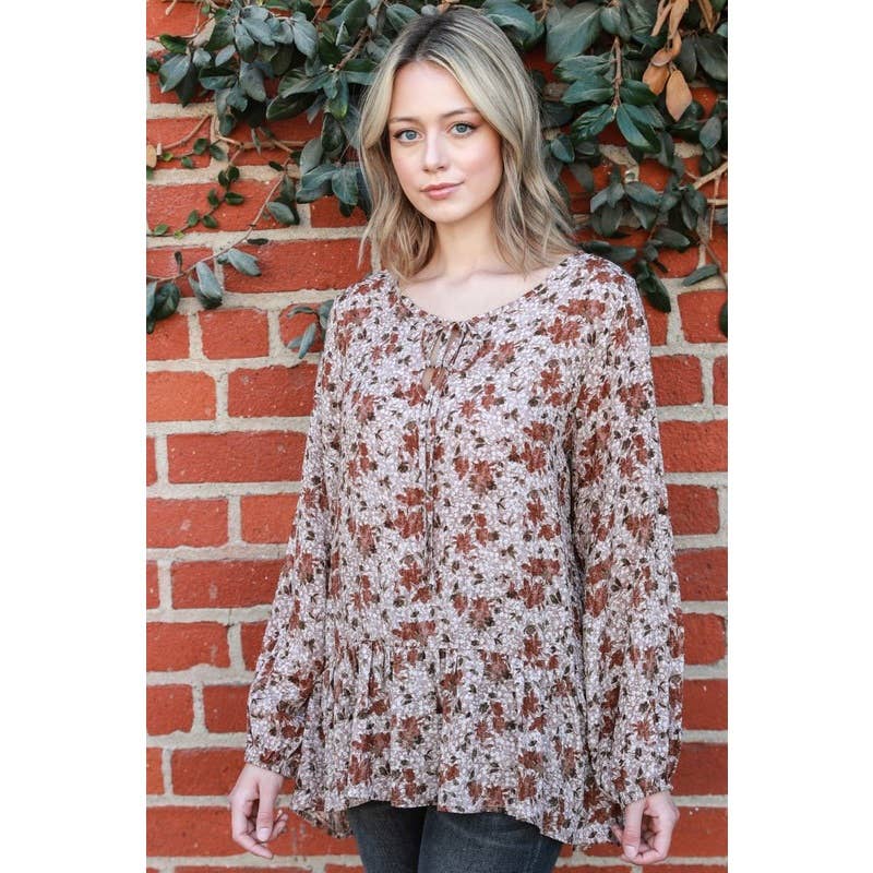 Moka Top con maniche a sbuffo con peplo floreale in vendita all'ingrosso su Faire3