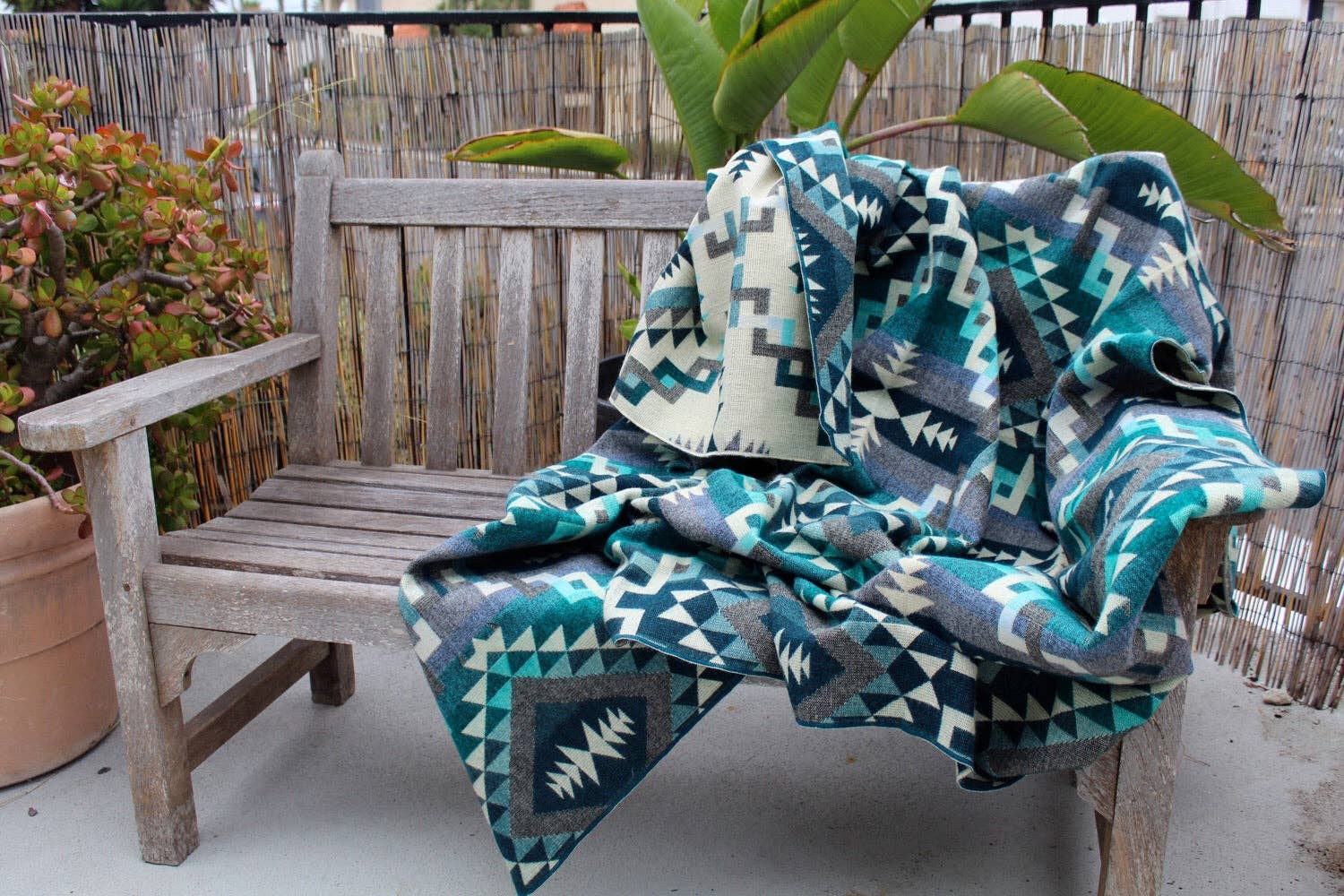 Aqua Agua de Los Andes Alpaca Blend Blanket for wholesale on Faire6