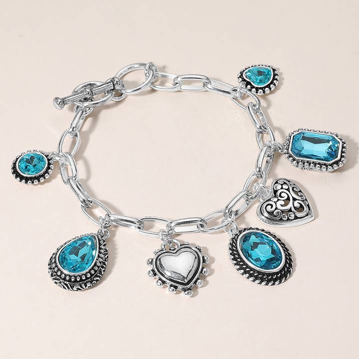 Teardrop Oval Round Stone Metal Heart Charm Station Bracelet for wholesale by Sensibling Corp.