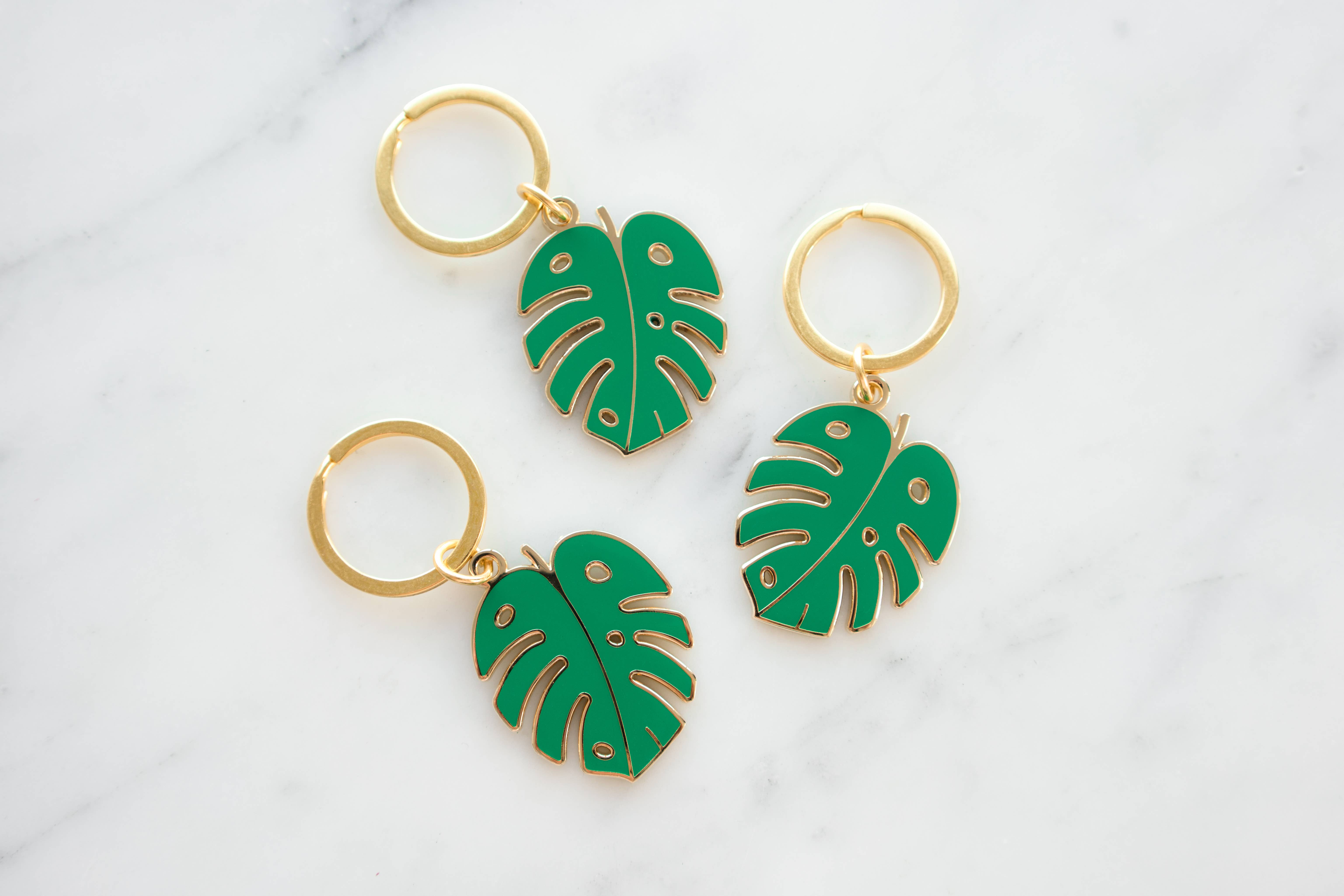 Gold green Monstera Leaf Keychain for wholesale on Faire1