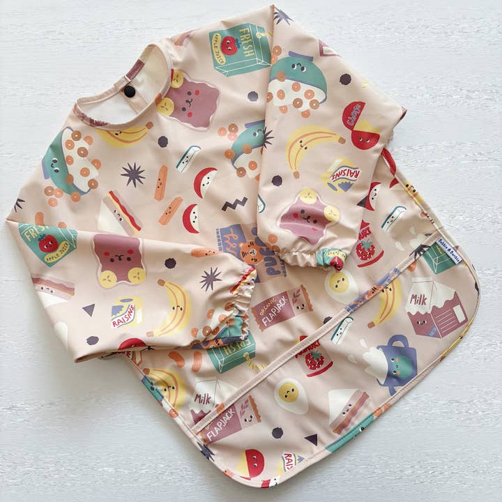 Snack Time Long-Sleeved Waterproof Bib (M & L Sizes) for wholesale by Bobbin and Bumble - Baby Changing Mats