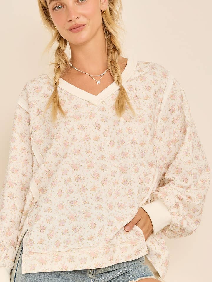 Felpa con scollo a V, maniche lunghe e stampa floreale oversize. per la vendita all'ingrosso da parte di Main Strip