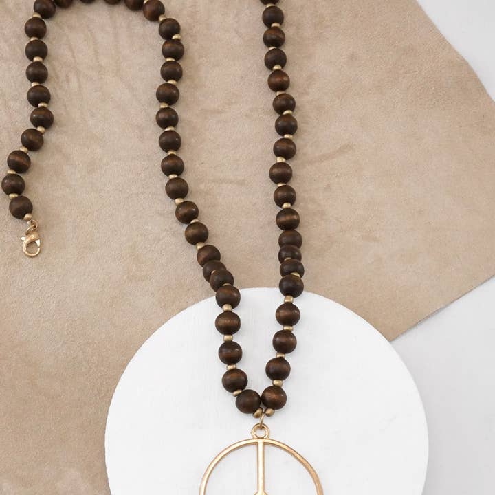 PennyLine inc - Wholesale Pendant/Charm Necklace - Long Wood Bead Necklace with golden peace sign pendant - Brown