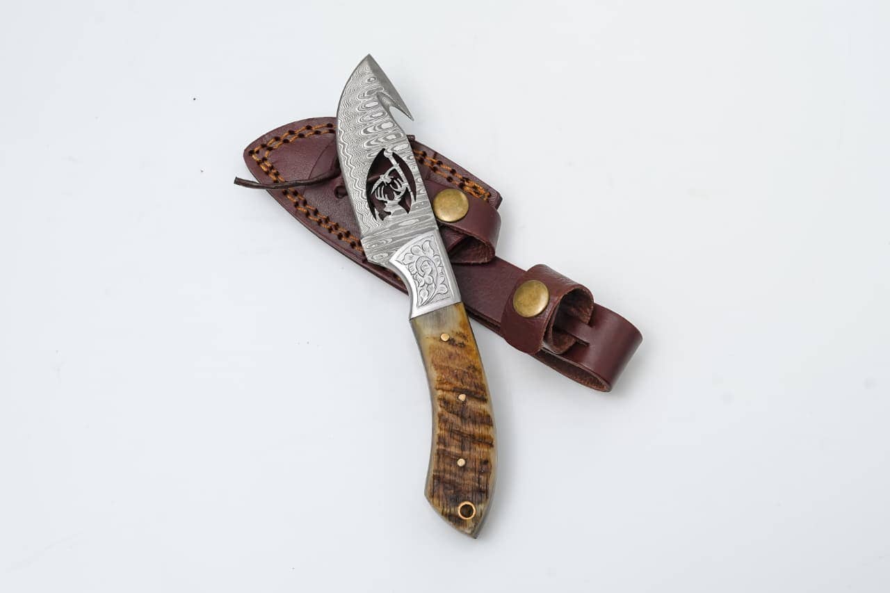 Titan International - Wholesale Pocket Knife/Holder - Wire-Cut Damascus Guthook Knife with Ram Horn Handle0