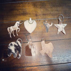 Purchase Wholesale cowhide keychain. Free Returns & Net 60 Terms on Faire