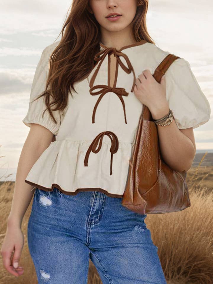 bow tie front bubble short sleeve cotton Top peplum blouse and other Purchase Wholesale peplum. Free Returns & Net 60 Terms on Faire trending on Faire.