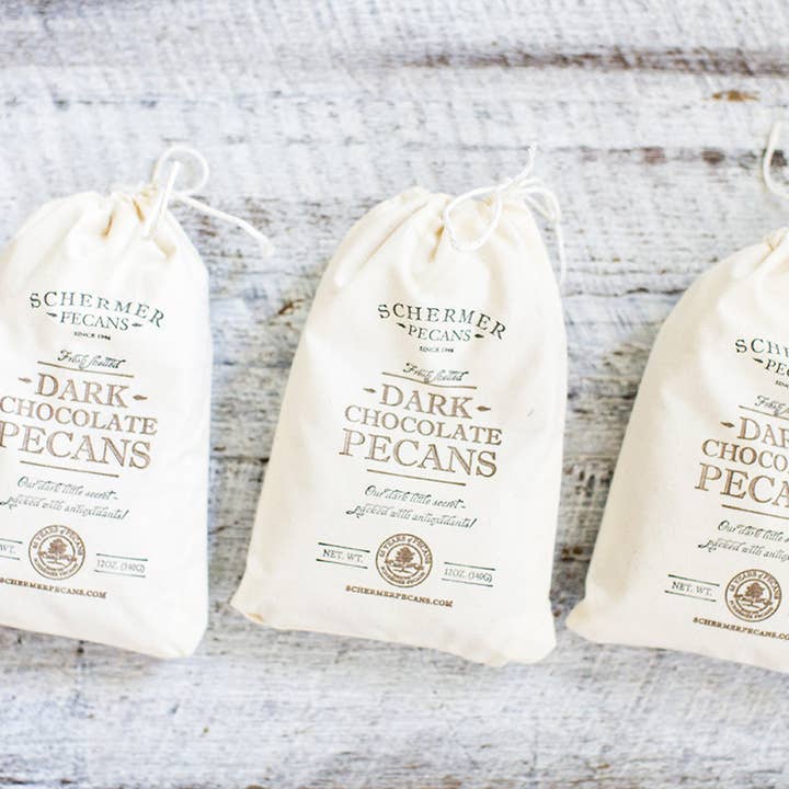NOZES PECÃS COM CHOCOLATE NEGRO - Produzido na GA - 12 Sacos de Tecido/Caixa por atacado de Schermer Pecans