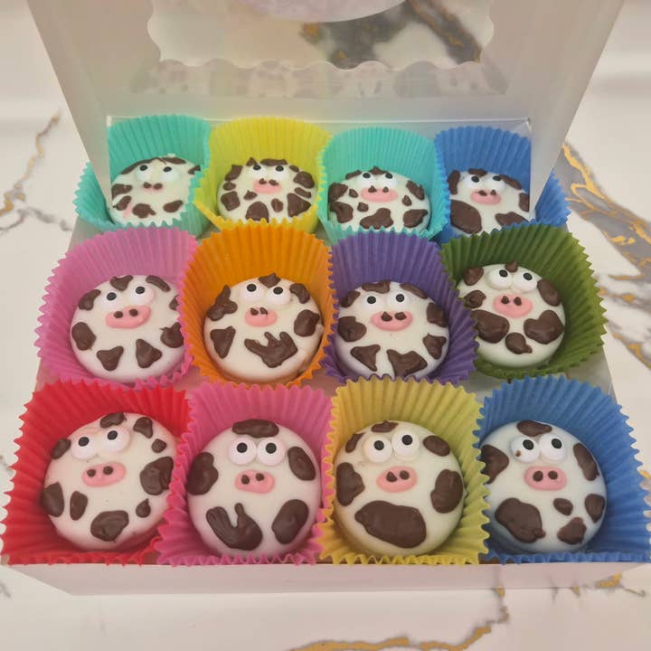 Cow Oreo's Hand Decorated box of 24 for wholesale by Bear Creek Candy Kitchen