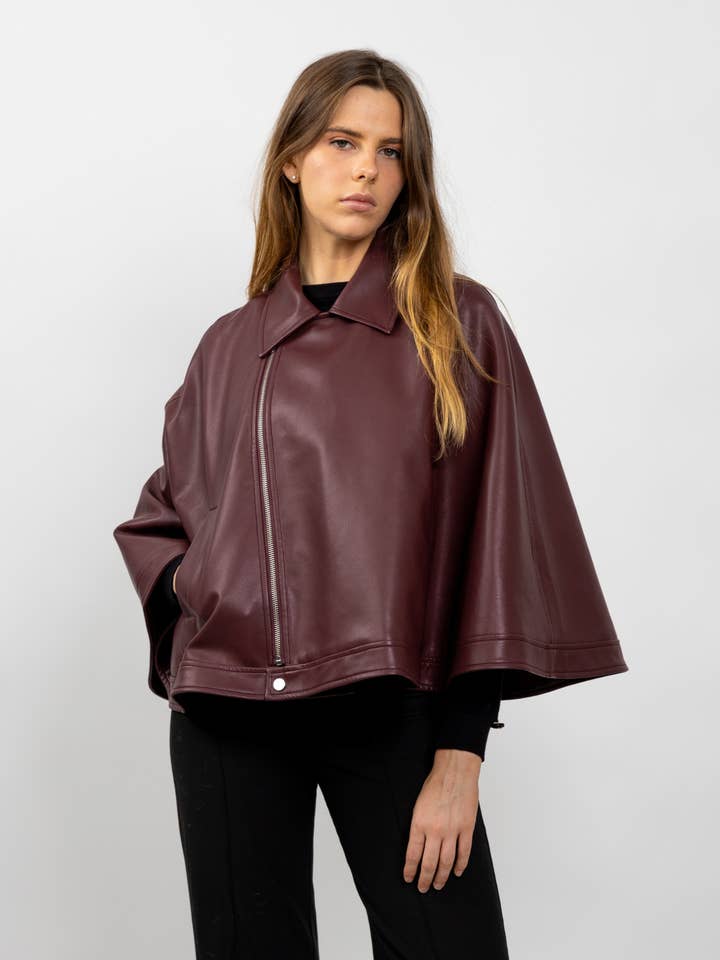 FAUX LEATHER CAPE and other Purchase Wholesale cloaks. Free Returns & Net 60 Terms on Faire trending on Faire.