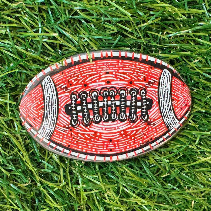 Bouton de football rouge et noir pour la vente par chanartchanart
