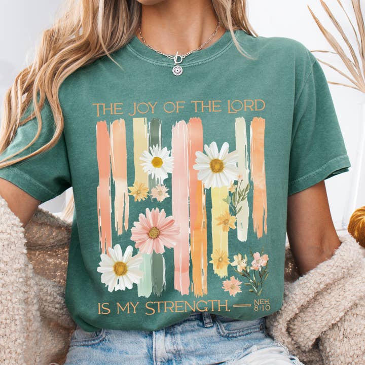The Joy of the Lord is my Strength Floral Comfort Colors Tee for wholesale by Scripted Pearl
