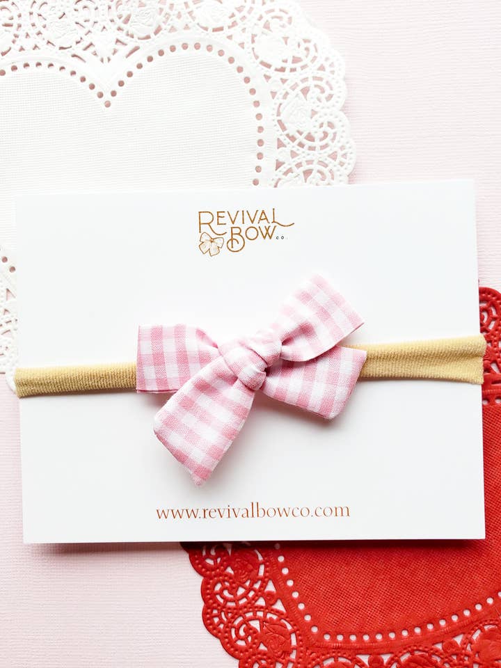 Valentine's Day Bow on Headband • Pink Gingham for wholesale by Revival Bow Co.