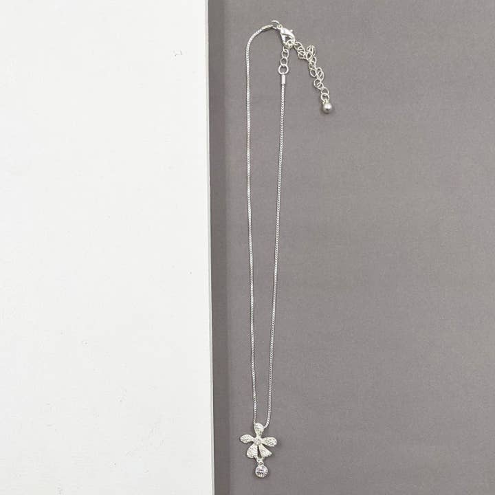 Delicate flower pendant nhecklace for wholesale by Tempest Designs