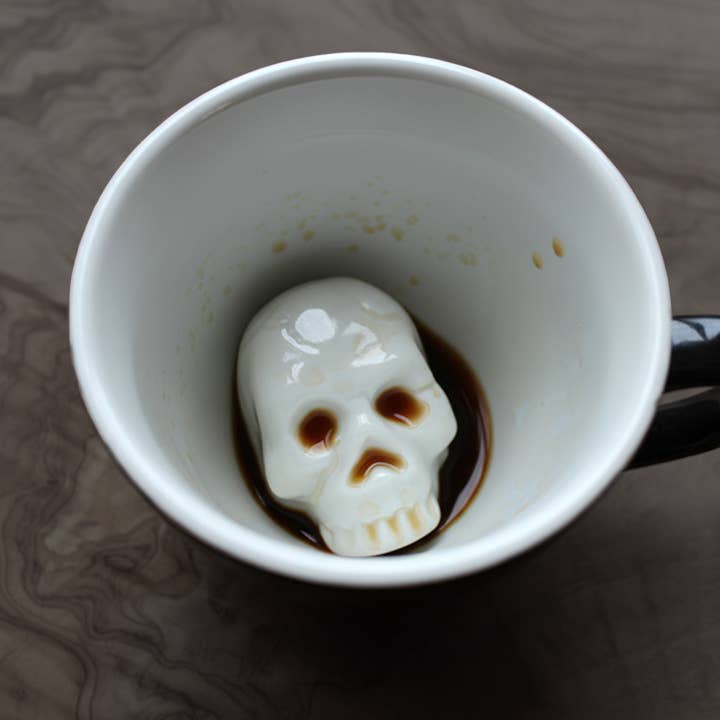 Black Skull | Ceramic Creepy Surprise Mug (11 oz. Black) for wholesale on Faire2