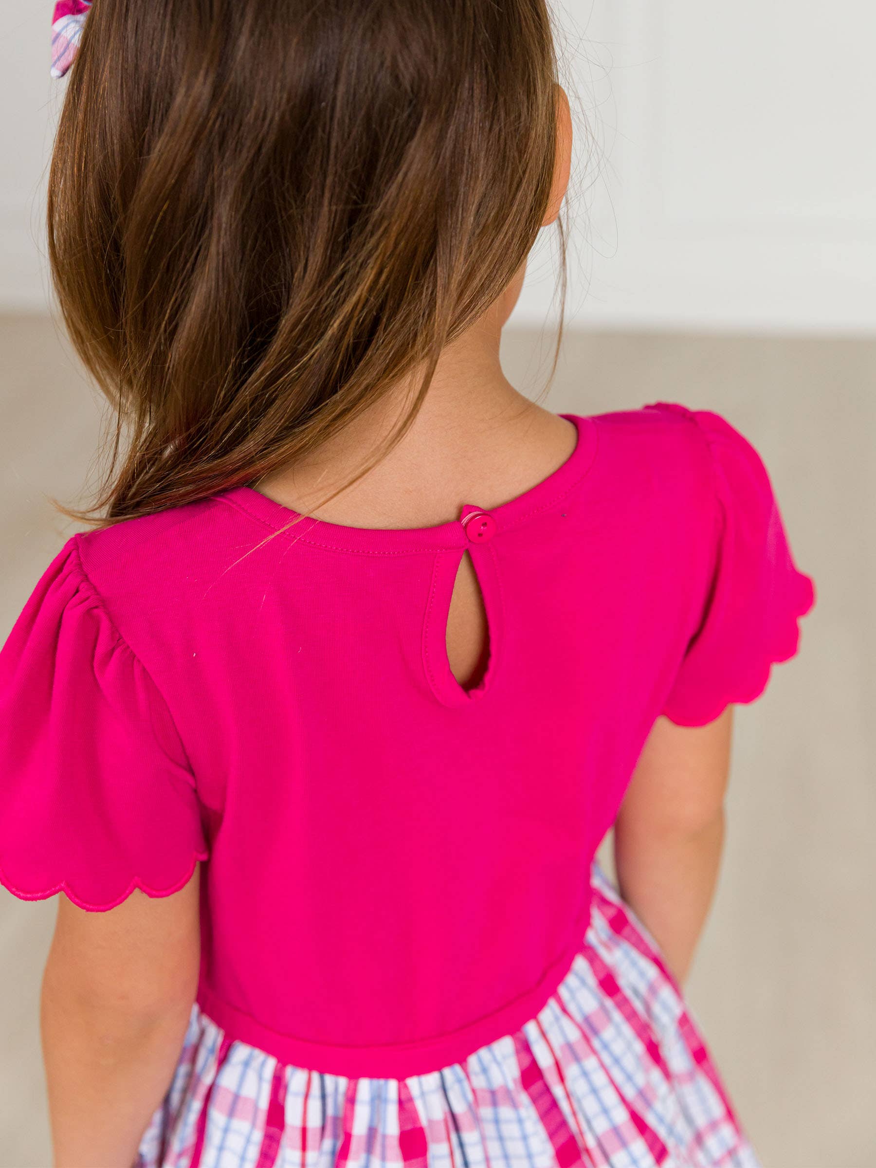 Pink Girls Adley Plaid Short Sleeve Tiered Dress for wholesale on Faire4