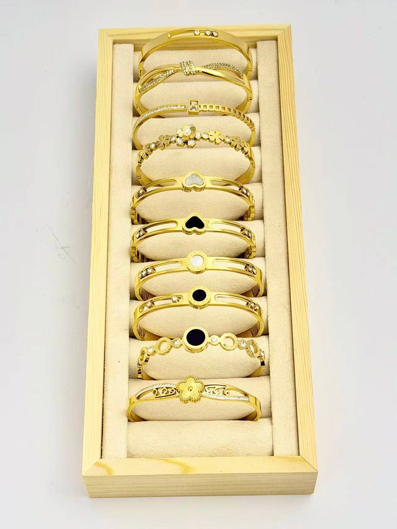 COSMOS - Wholesale Jewelry Set - Set of 10 elegant stainless steel bracelets on display1