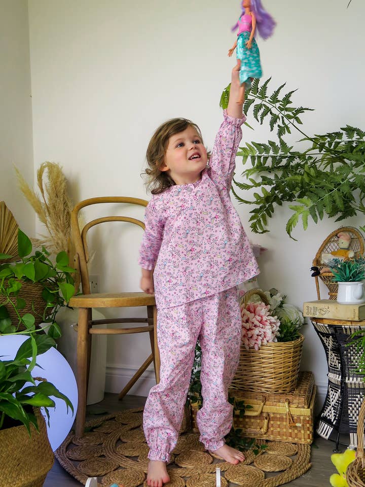 Pink Cosmic Moon & Star children's pyjama set for wholesale by Fox In A Box