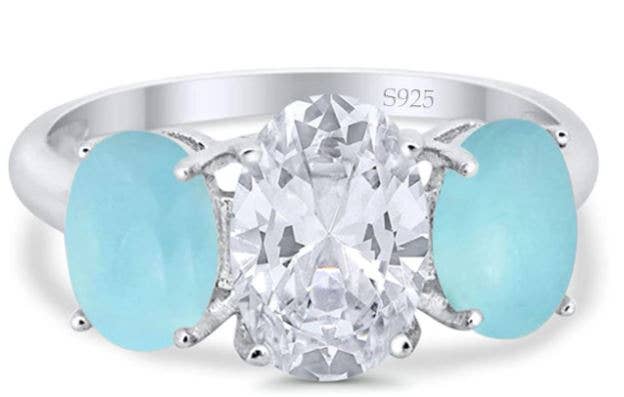3-Stone Oval Simulated Larimar Center Stone Clear CZ Fashion Ring for wholesale on Faire0