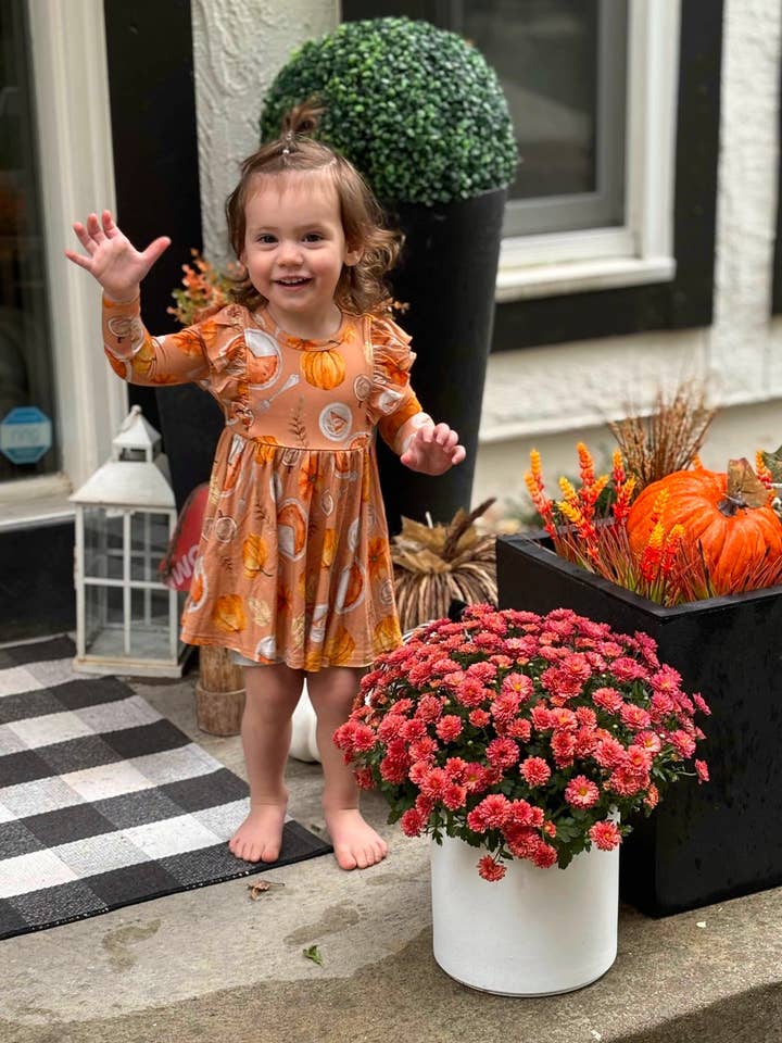 À mesa com babados de manga comprida com babados por atacado de Riley & Rett