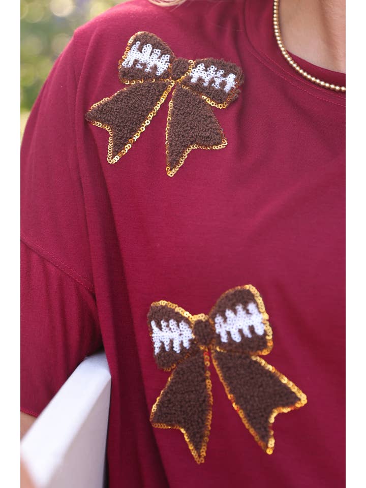 Sideline Sparkle Ruffle Top- Maroon for wholesale on Faire2